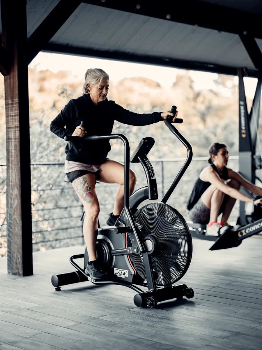 Guest on the air bike in the fully equipped outdoor gym