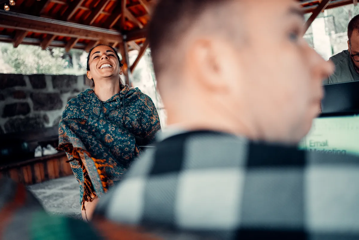 Guest laughing during a coaching workshop at an Elysium retreat