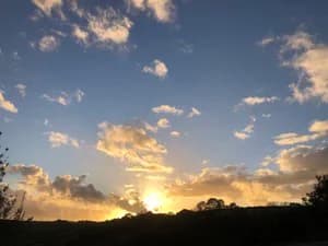 Golden sunset over the Welsh valley with clouds catching the light