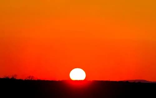 Vivid orange sunset over the Welsh hills at the retreat venue